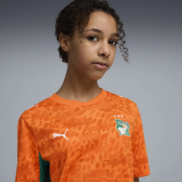 Puma FIFA WM 2026 Elfenbeinküste Heimtrikot kurzarm rickie orange/sport green (Junior)
