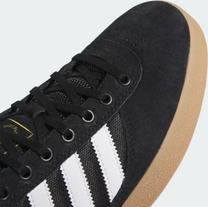 adidas Puig Indoor core black/cloud white/gum (Herren)