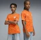 Puma FIFA WM 2026 Elfenbeinküste Heimtrikot kurzarm rickie orange/sport green (Junior) Vorschaubild
