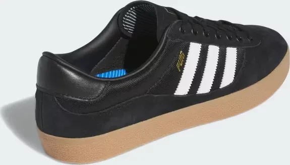 adidas Puig Indoor core black/cloud white/gum (Herren)