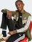 adidas Seasonal Essentials Tiberio 3-Streifen Tricot Trainingsanzug olive strata/white (Junior) Vorschaubild