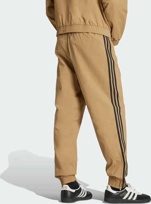 adidas Adicolor Woven Firebird Trainingshose lang beige/schwarz (Herren)