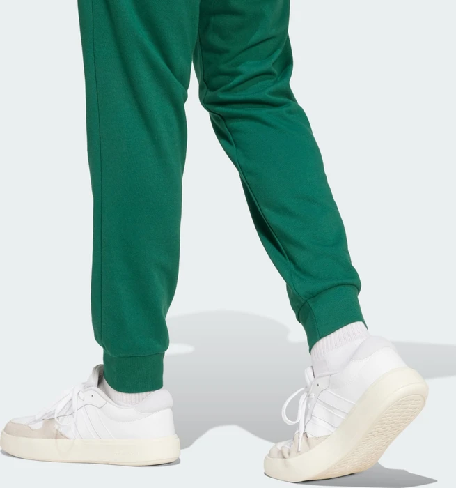 adidas Essentials Feel Cozy French Terry Trainingshose lang collegiate green/black (Herren)