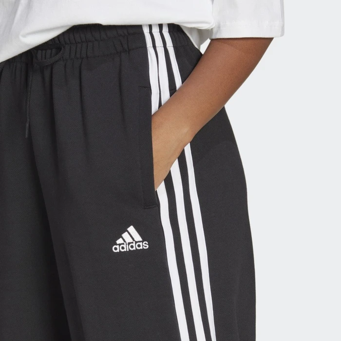 adidas Essentials 3-Streifen French Terry Loose-Fit Trainingshose lang schwarz/weiß (Damen)