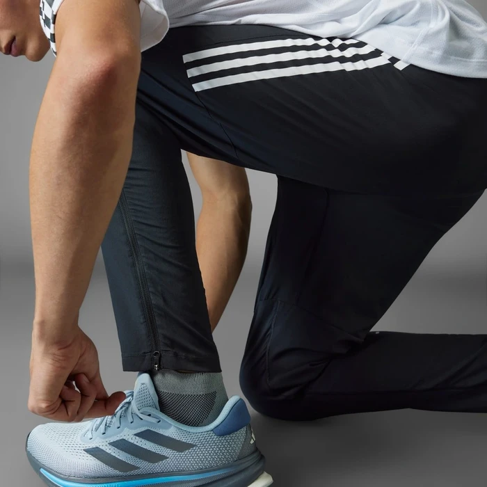 adidas Own the Run 3-Streifen Trainingshose lang schwarz (Herren)