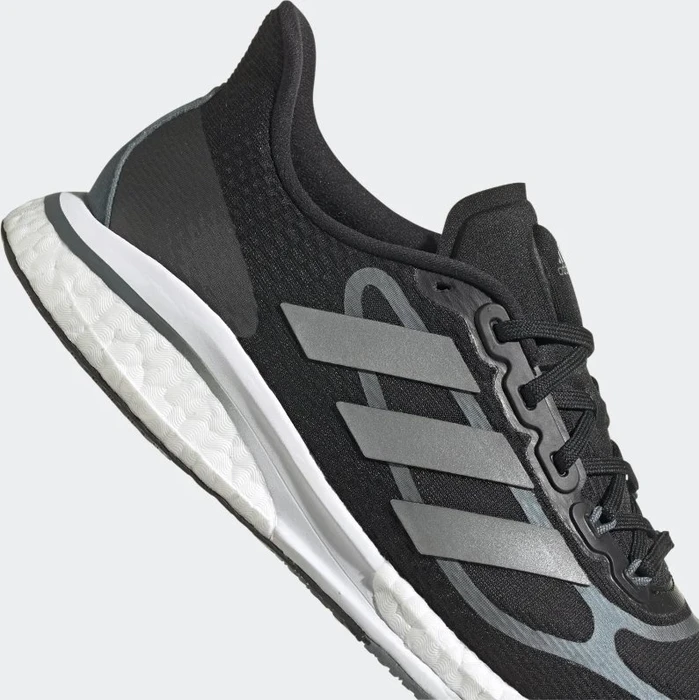 adidas Supernova+ core black/silver metallic/blue oxide (Damen)