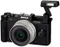 Pentax Q schwarz mit Objektiv Q 01 Standard Prime 8.5mm 1.9 AL und Q 02 Standard Zoom 5-15mm 2.8-4.5 AL Vorschaubild