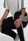 adidas Essentials 3-Streifen French Terry Cuffed Trainingshose lang schwarz/weiß (Damen) Vorschaubild