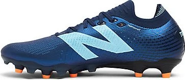 New Balance Tekela Elite Low Laced FG V5 1ST Edition nb navy/team sky blue/hot mango (Herren)