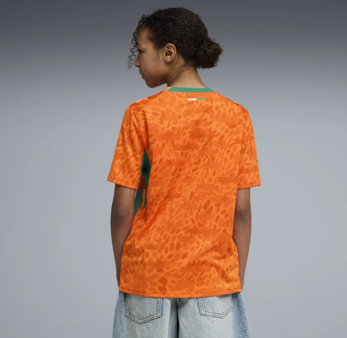 Puma FIFA WM 2026 Elfenbeinküste Heimtrikot kurzarm rickie orange/sport green (Junior)