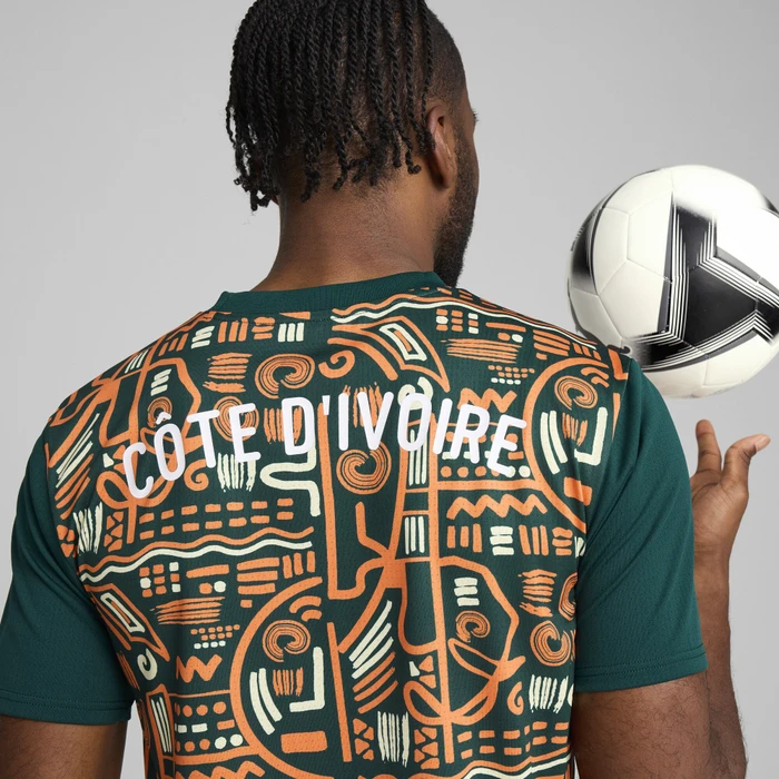 Puma FIFA WM 2026 Elfenbeinküste Aufwärmtrikot kurzarm dark myrtle/rickie orange (Junior)