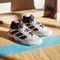 adidas Court Stabil cloud white/aurora met/aurora plum (Herren) Vorschaubild