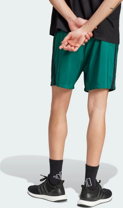 adidas Essentials 3-Streifen Chelsea Trainingshose kurz collegiate green/black (Herren)