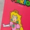 X Rocker Nintendo Super Mario Joy Collection Floor Rocker Gamingstuhl, Peach pink Vorschaubild