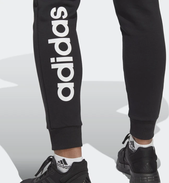 adidas Essentials Linear French Terry Cuffed Trainingshose lang schwarz/weiß (Damen)