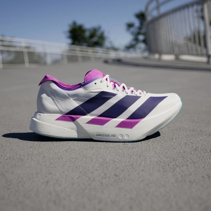 adidas Adizero Adios Pro 4 core white/collegiate purple/semi blue burst (Damen)