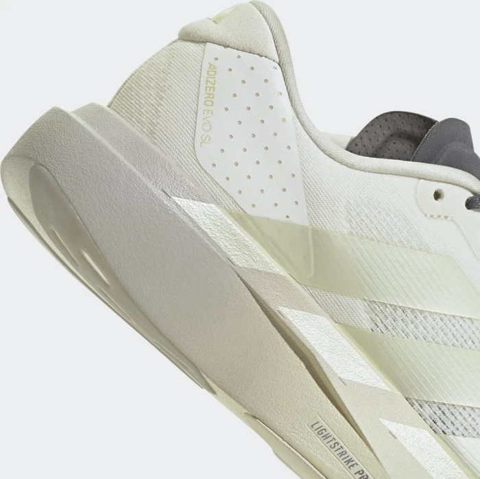 adidas Adizero Evo SL off white/ice gold met./granite (Damen)