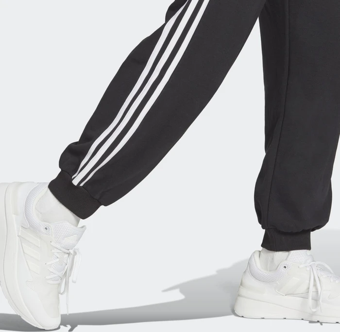 adidas Essentials 3-Streifen French Terry Loose-Fit Trainingshose lang schwarz/weiß (Damen)