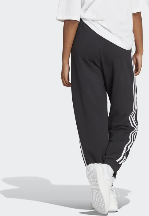 adidas Essentials 3-Streifen French Terry Loose-Fit Trainingshose lang schwarz/weiß (Damen)