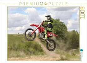 Calvendo Action-Bild von einem Motocross-Fahrer beim Sprung mit dem Motorrad